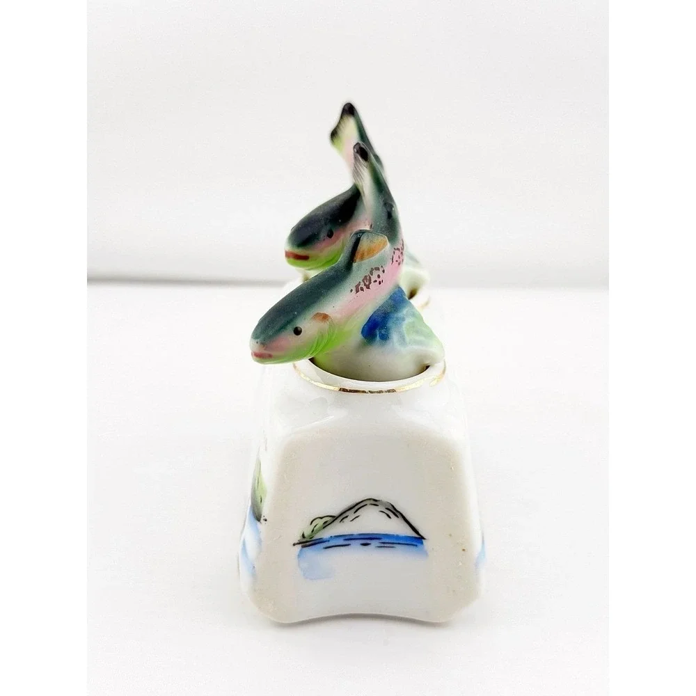 Vintage Japanese 1950's fish nodder salt & pepper shakers. Base shows fishing